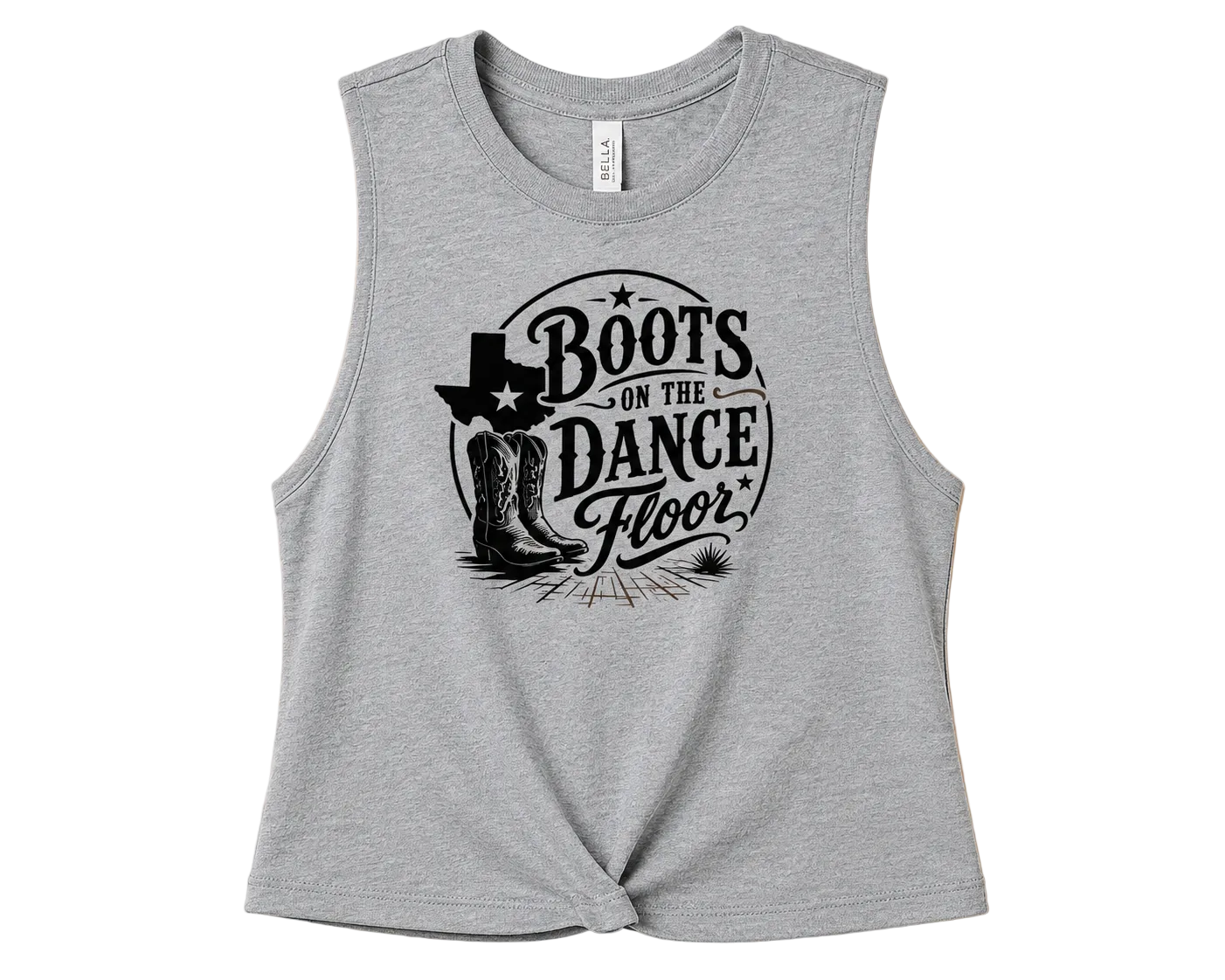 A heather gray sleeveless crop top with a black graphic print reading 'Boots on the Dance Floor' with cowboy boots and a hat, displayed flat against a solid peach background.