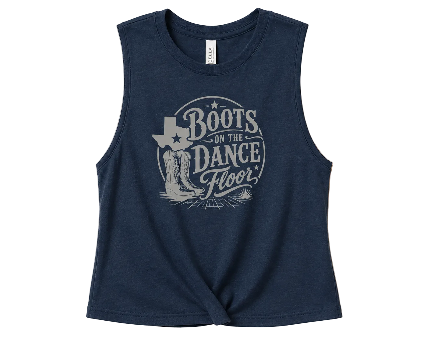 A sleeveless navy blue crop top with a distressed light gray graphic on the front that reads 'Boots on the Dance Floor' with cowboy boots and a Texas-shaped boot outline, shown on a solid beige background.