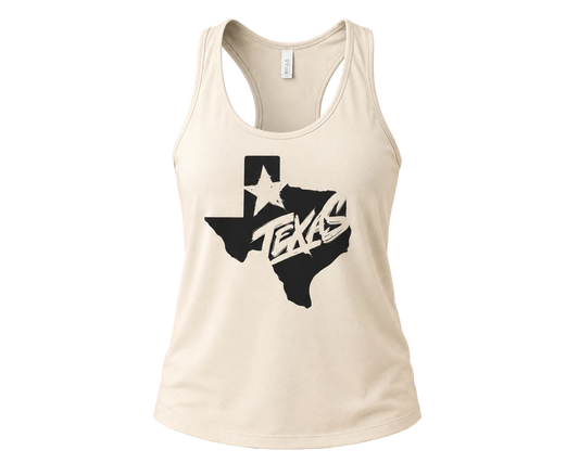An off-white racerback tank top featuring a black graphic of the state of Texas with a white star and the word 'TEXAS' in a stylized font, displayed against a solid beige background.