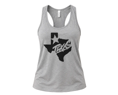 A heather gray racerback tank top featuring a black graphic of the state of Texas with a white star and the word 'TEXAS' in stylized lettering, displayed against a solid beige background.